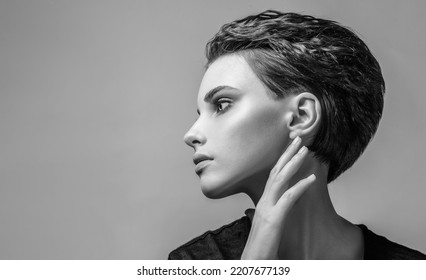 Monochrome portrait of an attractive girl with healthy skin and hair. Care and Beauty - Shutterstock ID 2207677139
