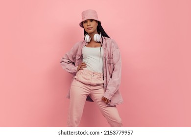 Monochrome portrait of young attractive happy woman in casual style outfit isolated on pink background. Concept of beauty, art, fashion, youth, sales and ads. Looks happy, delighted. Copy space for ad