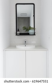 Monochrome Powder Room Vanity Black Mirror And White Tiling