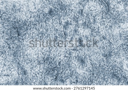 Monochrome textured background. Multidirectional strokes against a blurred background. Grunge style
