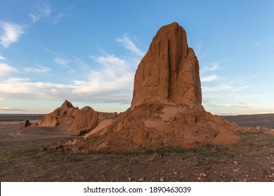 Monolith of red rock in the remote Mongolian landscape near the famous Flaming Cliffs tourist attraction in the Gurvan Saikhan National Park in the Gobi Desert of Mongolia