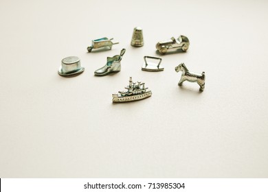 Monopoly Board Game, Playing Pieces On White Background