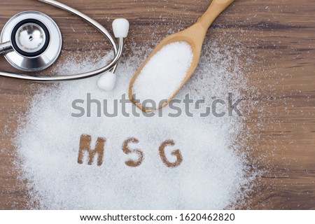 Monosodium glutamate (MSG ), ingredients in wooden spoon and words 