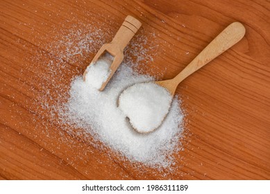 Monosodium Glutamate On Spoon And Wooden Table Background, MSG For Food Seasoning