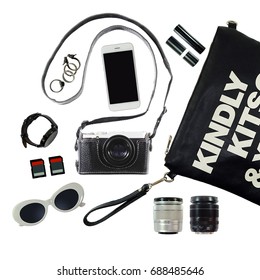 monotone accessory in lady bag for the trip, clutch bag, camera, lipstick, smartphone, ring, hand watch, sunglasses, memory card, camera lens isolate on white background - Shutterstock ID 688485646