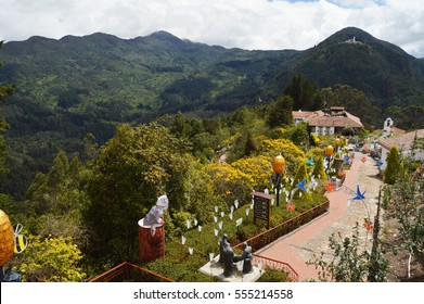 Monserrate mountain in Botoga, Colombia, colourful decorations and dark green hills in background