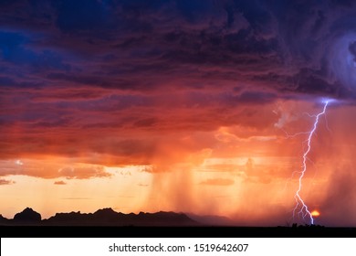 Monsoon thunderstorm and lightning bolt at sunset in the Arizona desert - Powered by Shutterstock