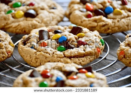 Monster cookies on a wire cooling rack