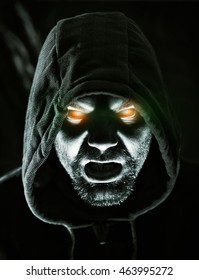 Monster In Hood With Glowing Eyes