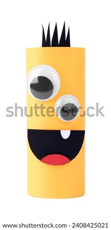 Monster made of yellow paper isolated on white. Halloween decoration