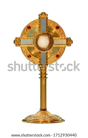 monstrance or ostensorium displaying the consecrated host, the Body of Christ isolated on white background