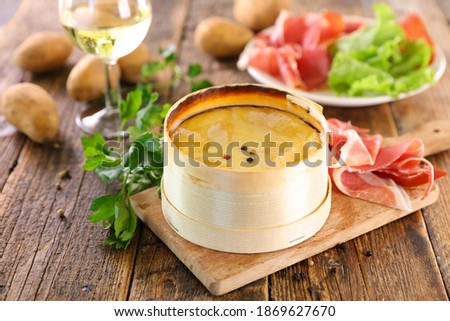 Similar – Image, Stock Photo Cheese Board with Ham, Cheese and a Knife