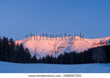 Mont Joly and forests at sunset in Europe, France, Rhone Alpes, Savoie, Alps, winter.