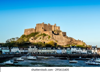Mont Orgueil Castle (Gorey Castle, built 1204 - 1450) in the small town of Gorey at sunset. Jersey, UK.