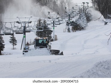 Mont Saint Bruno Ski Resort, Québec, Canada, December 18 2021, Ski Resort Worker With Snow Cannon And Snow Plow