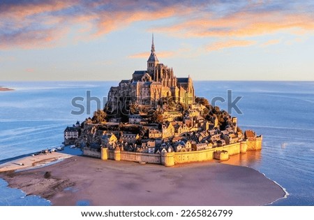 Mont Saint-Michel. Aerial view from the southeast during sunrise. Normandy, France.