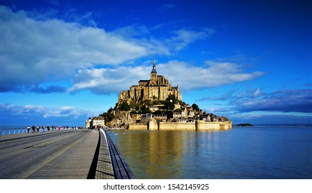 Mont Sant Michel, High Tide, Low Tide. Abbey Of Mont Sant Michel. Monastery In Normandy