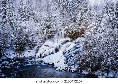 Mont Tremblant, Qc, Canada - January 18th 2021: View On Devil's River Waterfall (Chute De La Rivière Au Diable) Under The Snow During Winter, Located Near Mont Tremblant In Quebec (Canada)