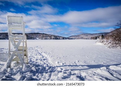 Mont Tremblant, Qc, Canada - January 18th 2021: View On The Mercier Lake Beach During Winter, With The Lake And The Beach Covered With Snow