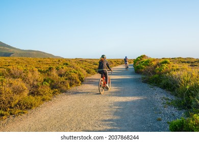 Montana De Oro, California-USA, May 8, 2021 Young Couple Cycling On Rural Road In Montana De Oro State Park, Los Osos, California Central Coast