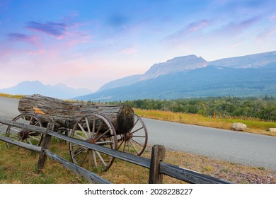Montana Landscape with an old wagon and a wood log at sunrise in West Glacier, Montana USA