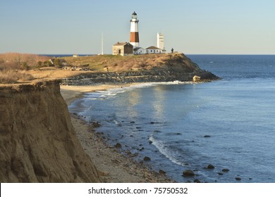 Montauk Lighthouse with an eroding bluff in the foreground on the Eastern tip of Long Island, NY
