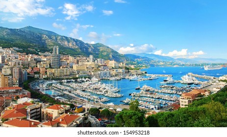 Monte Carlo city panorama. View of luxury yachts and apartments in harbor of Monaco, Cote d'Azur.