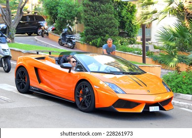 MONTE CARLO, MONACO - AUGUST 2, 2014: Orange supercar Lamborghini Gallardo Spyder at the city street.