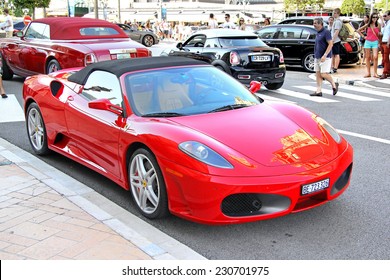 MONTE CARLO, MONACO - AUGUST 2, 2014: Red italian supercar Ferrari F430 Spider at the city street near the casino.