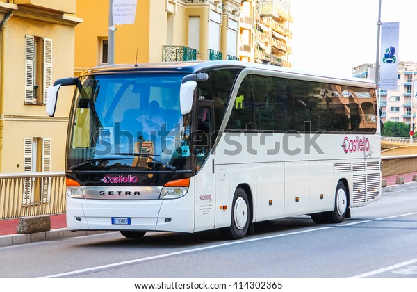 MONTE CARLO, MONACO - AUGUST 2, 2014: White\
coach bus Setra S415HD in the city\
street.
