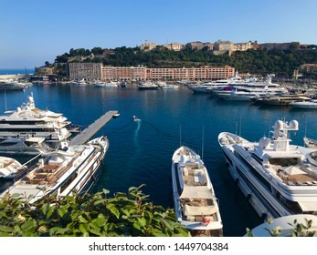 Monte Carlo, Monaco - July 12 2019: port harbour marina bay yachts boats beach seaside coast coastline maritime travel summer holiday