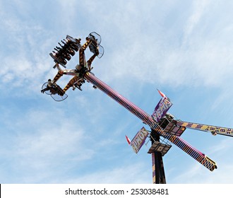 MONTE CARLO, MONACO - NOVEMBER 2, 2014: People Wait Up In The Blue Sky For The Vertical Ride And The Zero Gravity Thrill At An Amusement Park