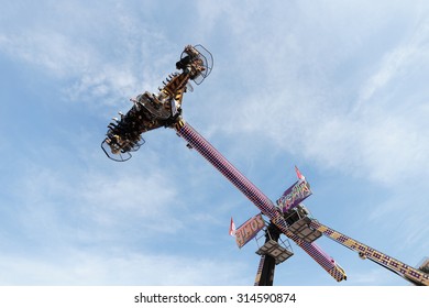 MONTE CARLO, MONACO - NOVEMBER 2, 2014: People Wait Up In The Blue Sky For The Vertical Ride And The Zero Gravity Thrill At An Amusement Park