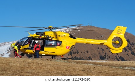 Monte Pora. Bergamo. Italy. February 5, 2022. Rescue Helicopter Over The Mountains To Help Hikers. First Aid Helicopter. Team Ready For Emergency Response. Medical Rescue Helicopter On The Ground