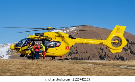 Monte Pora. Bergamo. Italy. February 15, 2022. Rescue Helicopter Over The Mountains To Help Hikers. First Aid Helicopter. Team Ready For Emergency Response. Medical Rescue Helicopter On The Ground