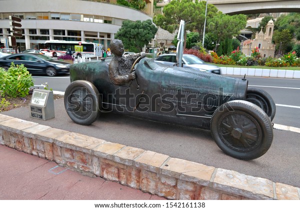 Monte-Carlo, Monaco / Monaco - 09 06 2019: The statue of\
William Grover in his 1929 Bugatti, the first winner of the Monaco\
Formula 1 Grand Prix, old driver statue                            \
   