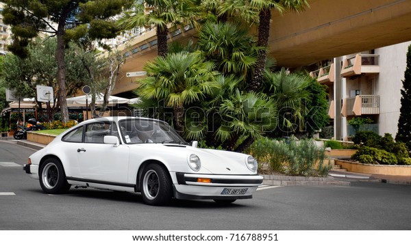 Monte-Carlo, Monaco -\
12.08.17: Porsche 911 classic car on one of the streets of\
Monte-Carlo. The likes of this white sports car can be commonly\
seen on the territory of\
Monaco.