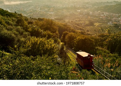 Montecatini Alto Funicular Going Up During A Warm Tuscan Sunset In Italy In The Province Of Pistoia