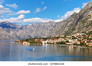 Montenegro. Kotor Bay. A Picturesque View From The Water To The Coastal Town Of Dobrota, The Institute Of Marine Biology And The Old Small Church Of St. Ilijah