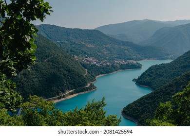 Montenegro. View of Lake Piva, located between the mountains. The lake is an artificial reservoir of fresh water. Bright blue sky