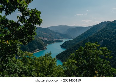 Montenegro. View of Lake Piva, located between the mountains. The lake is an artificial reservoir of fresh water. Bright blue sky