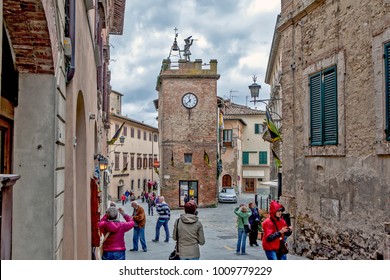 MONTEPULCIANO, ITALY - MAY 4, 2014: Photo of Palazzo-tower, with the figure of Pulcinella. Old city.