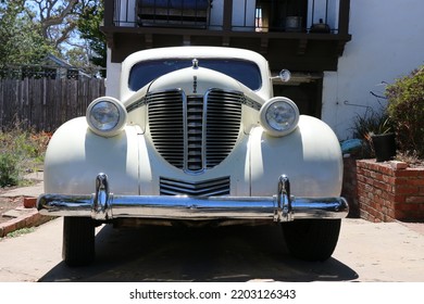 Monterey, CA, USA - 18 Aug 2022: Beautiful, Classic Cream Colored DeSoto In Pristine Condition Is Parked In A Driveway In Monterey During Classic Car Week.