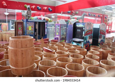 Monterey, CA, USA 
June 1, 2021
Wine Barrels Covering The Ground With Old Video Games In The Middle At A Store. 