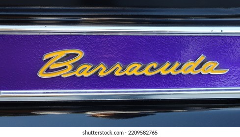 Monterey, CA, USA - September, 30, 2022: Plymouth Barracuda Emblem Custom Painted In Purple And Gold LA Lakers Colors