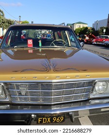 Monterey, CA, USA - September, 30, 2022: Bobble Hula Dancer Girl On Dashboard Of Chrysler Front View