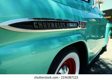 Monterey, California, USA - August 18, 2022: Monterey Car Week 2022, A Mint Green Classic Truck, Chevrolet Apache With Red And Chrome Rims And White Wall Tires