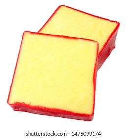 Monterey Jack Cheese Squares With Red Wax Coating Isolated On A White Background