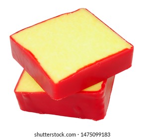 Monterey Jack Cheese Squares With Red Wax Coating Isolated On A White Background