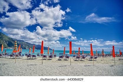 Monterosso Al Mare Beach Side With Orange Umbrellas.